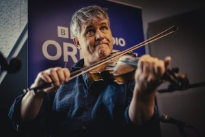 Dirk Powell, Cedric Watson and Amelia Powell at the Orkney Folk Festival 2026 - photographs by David at the Hall of Einar
